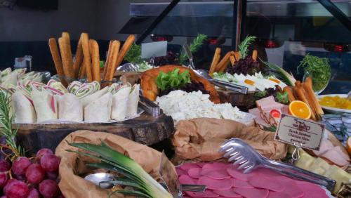 a display of different types of food on a table at Hotel Black Tulip in Istanbul