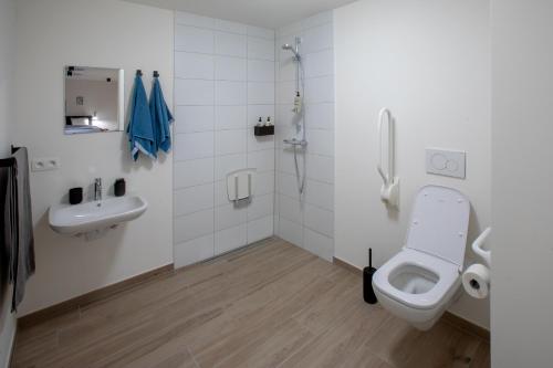Vannituba majutusasutuses Qstay Good Living Apartments