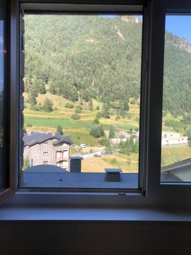 a window with a view of a mountain at Ribasol Ski Park 5 pers, max 4 adults, HUT7602 in Arinsal