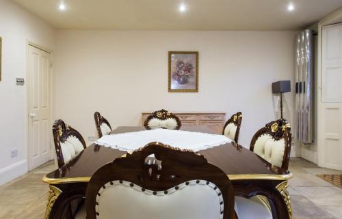 a dining room with a table and chairs at Dale Street Apartments Suite in Leamington Spa