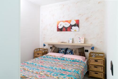 Tempat tidur dalam kamar di Apartment Fiordaliso