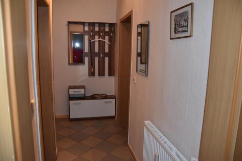 a hallway with a stairway leading to a room at Flora in Galenbeck