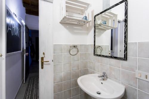 a bathroom with a sink and a mirror at Amunì in Palermo