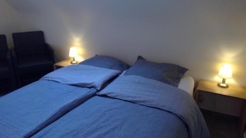 
Ein Bett oder Betten in einem Zimmer der Unterkunft De Blauwvoet Studio
