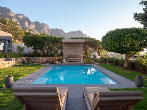 a swimming pool in the backyard of a house at Atholl House in Cape Town