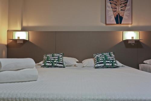 Katil atau katil-katil dalam bilik di Sandri City Hotel