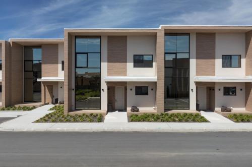 an image of a building with glass windows at Magic Village Views Trademark Collection by Wyndham in Orlando