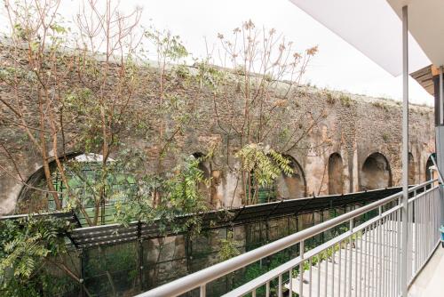 a staircase leading up to a brick wall at THE IMPERIAL SUITE e THE BRICKS in Rome