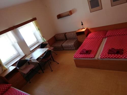 Postel nebo postele na pokoji v ubytování Penzion Rudolfovna