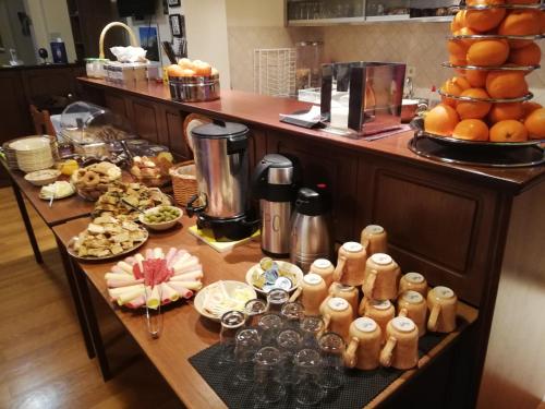 a buffet of food on a table in a kitchen at Xenonas Kypseli in Kipseli