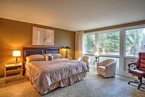 a bedroom with a bed and a large window at Spacious South Haven Home about 1 Mi to Lake Michigan! in South Haven