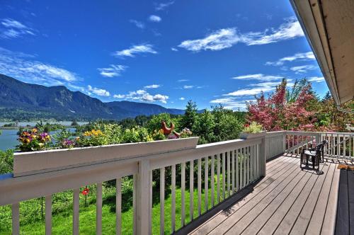 a deck with a view of a lake and mountains at Anns Aerie Home with Gorgeous Views and Special Rates! in Stevenson