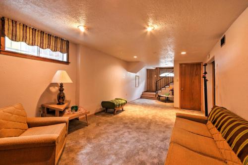 a living room with two couches and a room with a bed at Bright Springer House with Hammock and Orchard Views! in Springer