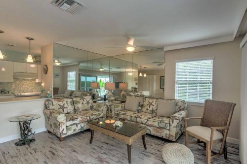 a living room with two couches and a table at Waterfront Marco Island Retreat with Shared Docks in Marco Island