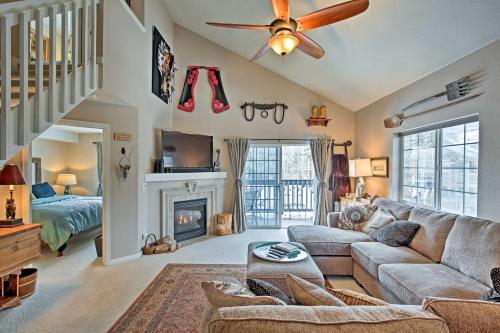 a living room with a couch and a fireplace at Steamboat Springs Condo with Hot Tub and Ski Bus! in Steamboat Springs