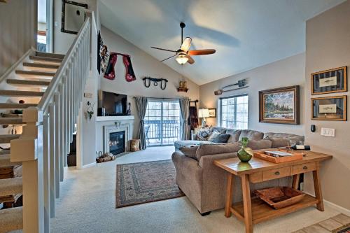 a living room with a couch and a table at Steamboat Springs Condo with Hot Tub and Ski Bus! in Steamboat Springs