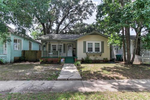 a small house with a green and yellow house at Cozy Gulfport Home Walk to Beach, Marina and Casino in Gulfport