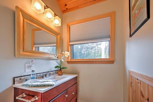 a bathroom with a sink and two windows at Waterfront Prospect Harbor Cottage Yard, Fire Pit in Prospect Harbor