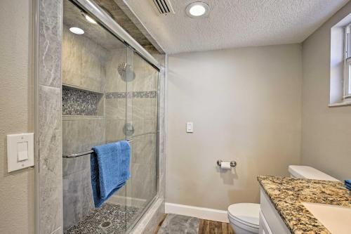 a bathroom with a shower and a toilet at Waterfront Tampa Home with Pool, Lanai, and Dock! in Tampa