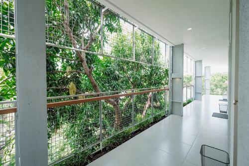 a hallway with a green wall of plants at Djajanti House in Semarang