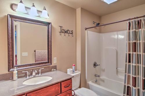 a bathroom with a sink and a toilet and a shower at Bella Greens Spacious Sturgis Home with Large Deck in Sturgis