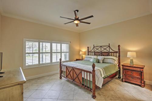 a bedroom with a bed and a ceiling fan at Oceanfront Oasis with Deck, Water Views and Beach Gear in Flagler Beach