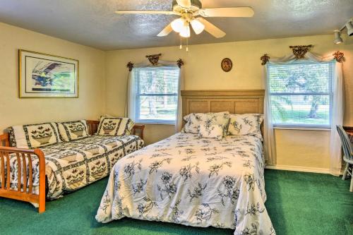 a bedroom with two beds and a ceiling fan at Sandford Vacation Rental Near Airport and Lake! in Sanford