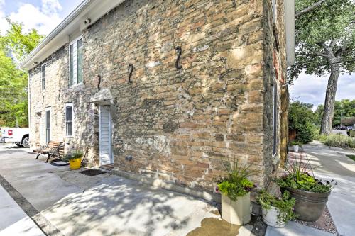 a brick building with plants on the side of it at Historic Laramie Condo - 3 Blocks to Downtown and UW in Laramie