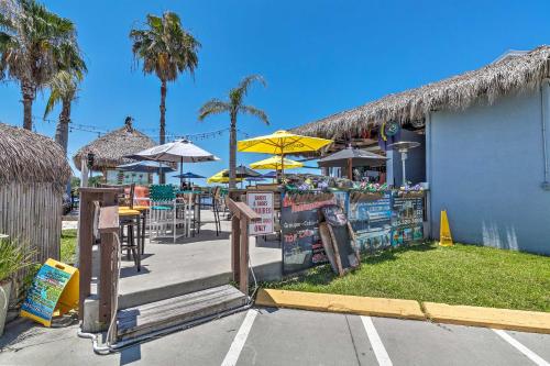 a restaurant with tables and chairs and umbrellas at Riverfront Homosassa Retreat with Kayak and Boat Dock! in Homosassa