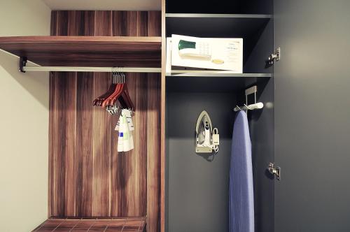a closet with a wooden door in a room at Holiday Inn Express Puerto Vallarta by IHG in Puerto Vallarta