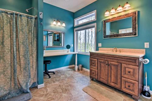 a bathroom with a sink and a mirror at Private Blue Ridge Home with Hot Tub, Mountain Views in Marshall