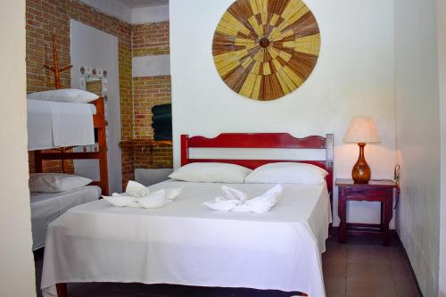 Una cama o camas en una habitación de Pousada Maanaim 2
