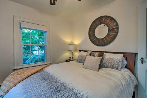 a bedroom with a bed with a mirror on the wall at Waterfront Harveys Lake House with Private Dock! in Harveys Lake