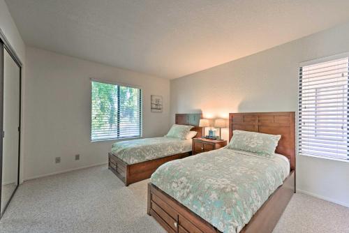 a bedroom with two beds and a window at Cathedral City Condo with Pool, 7 Mi to Palm Springs in Cathedral City