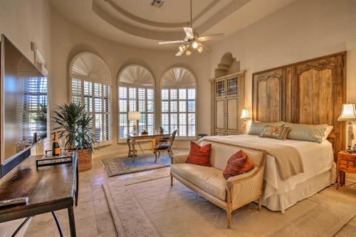 a bedroom with a bed and a couch and a table at Lavish Paradise Valley Home with Sports Court and Pool in Scottsdale