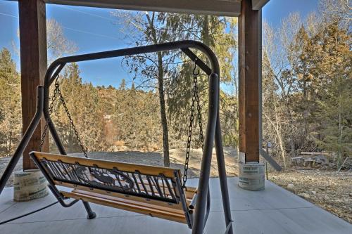 a swing on a porch with a view at Mammoth Creek Apt Between Bryce Canyon and Zion! in Hatch