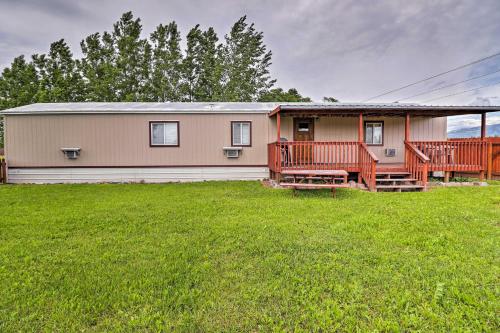 a house with a large yard in front of it at Columbia Falls Home about 22 Mi to Glacier Natl Park! in Columbia Falls
