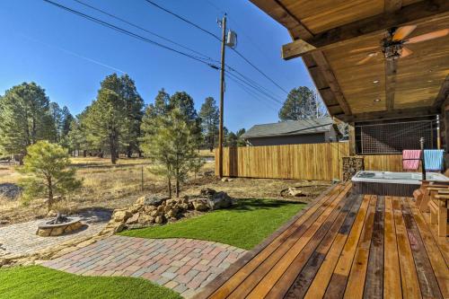 a deck with a hot tub on a house at Home with Jacuzzi 10 Mi to NAU and Flagstaff! in Mountainaire