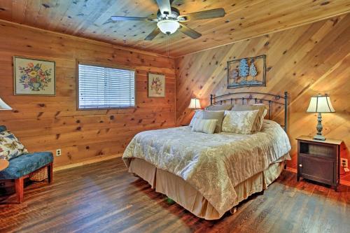a bedroom with a bed and a ceiling fan at Cozy Home with Patio Near Yosemite National Park! in Mariposa