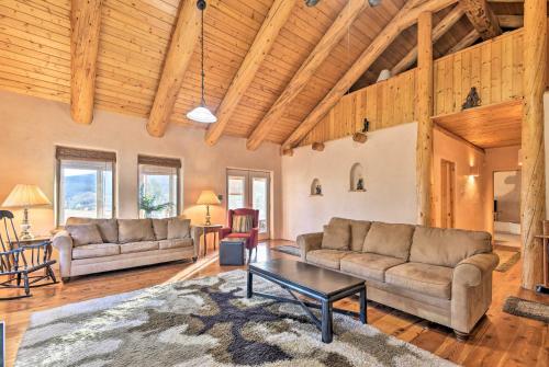 a living room with two couches and a table at Eagle Nest Home with Hot Tub and Views - 5 Min to Lake in Eagle Nest