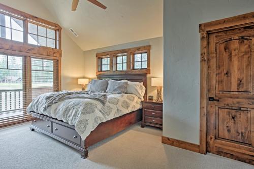 a bedroom with a bed and a dresser and a window at Cle Elum Home on Golf Course with Fire Pit and Hot Tub in Cle Elum