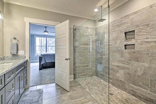 a bathroom with a shower with a glass door at Lake Keowee Home with Balcony and Boat Dock! in Seneca