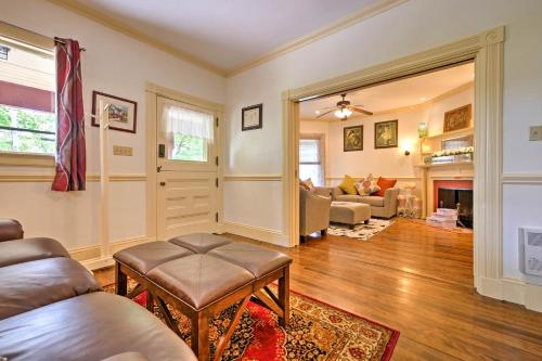 a living room with a couch and a table at Central Bar Harbor Home, Walk to the Shore and Town! in Bar Harbor