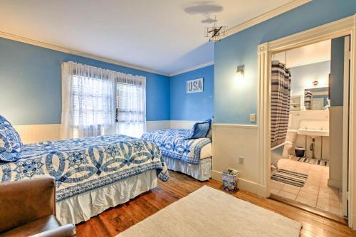 a bedroom with two beds and a mirror at Central Bar Harbor Home, Walk to the Shore and Town! in Bar Harbor