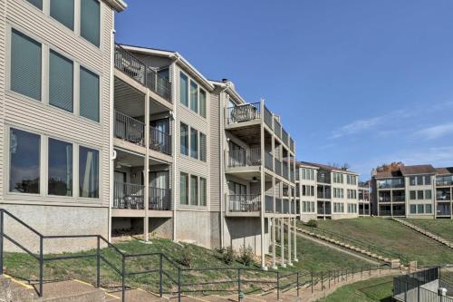 an apartment building with balconies on the side at Lake Ozark Condo with Pool and Fishing Docks! in Lake Ozark