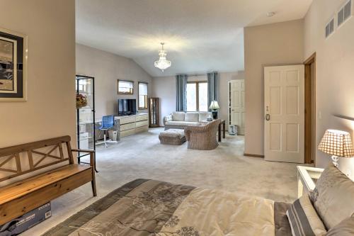 a large living room with a bed and a couch at Eagan Home with Porch - 5 Mi to Mall of America! in Eagan