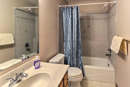 a bathroom with a sink and a toilet and a shower at Eagan Home with Porch - 5 Mi to Mall of America! in Eagan