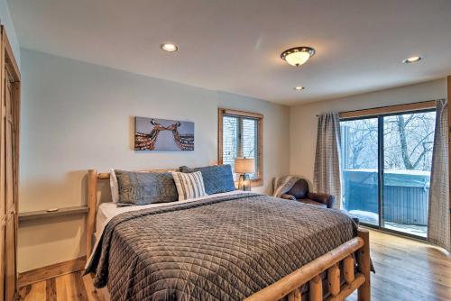 a bedroom with a bed and a window at Cabin with Hot Tub and Mountain Views, Less Than 5 Mi to Boone in Blowing Rock