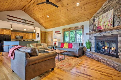 a living room with two couches and a fireplace at Cabin with Hot Tub and Mountain Views Less Than 5 Mi to Boone in Blowing Rock