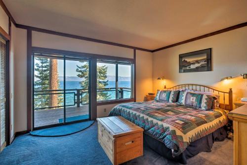 a bedroom with a bed and a large window at 11 Mi to Palisades Tahoe Lakefront Home with View! in Tahoe City